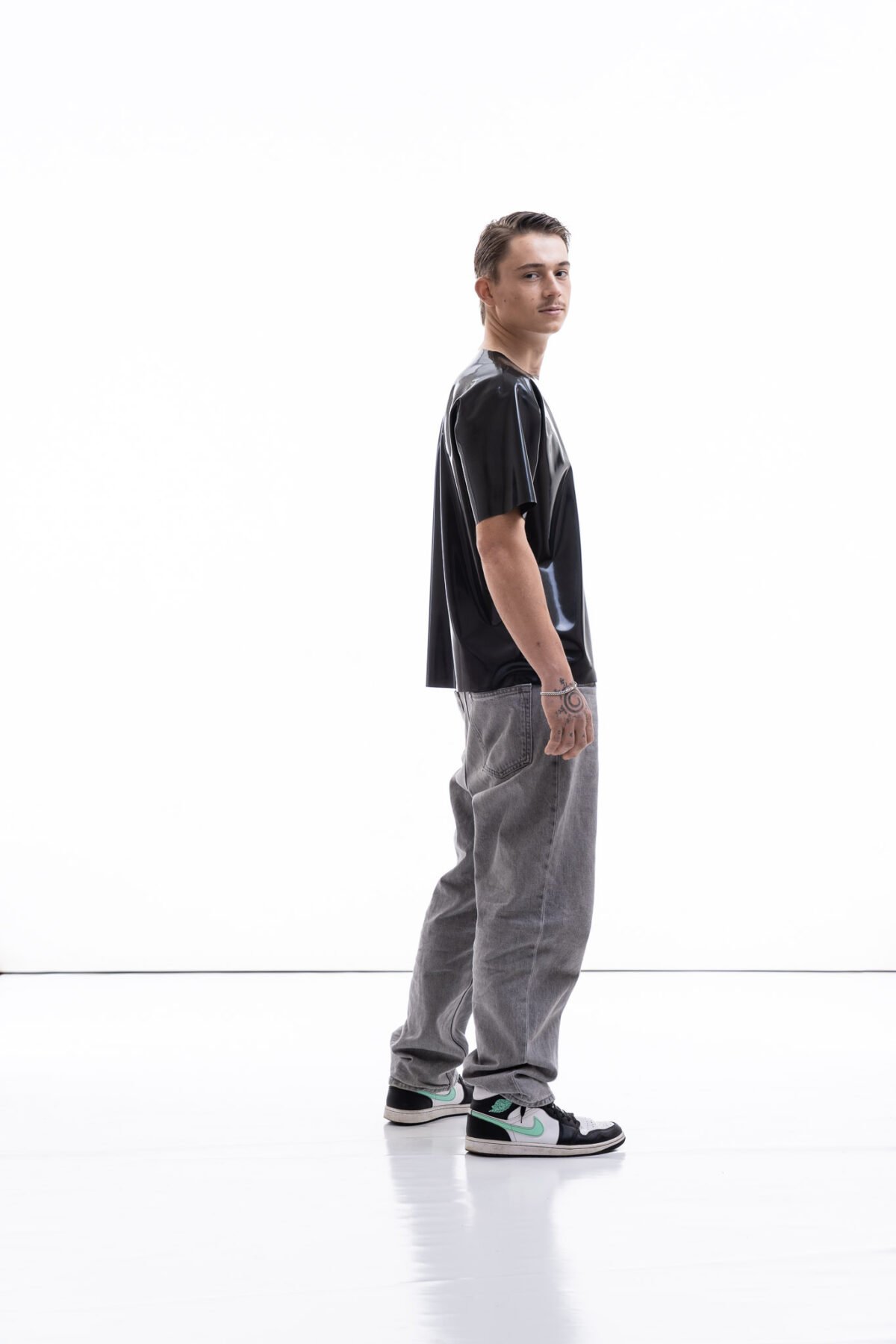 Metallic oversized latex shirt for men with relaxed fit, side view