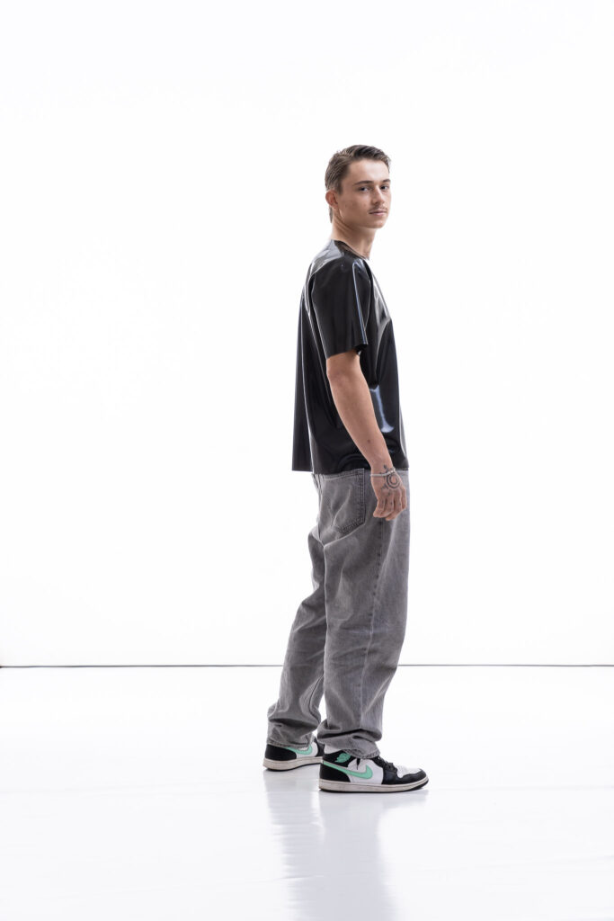 Metallic oversized latex shirt for men with relaxed fit, side view