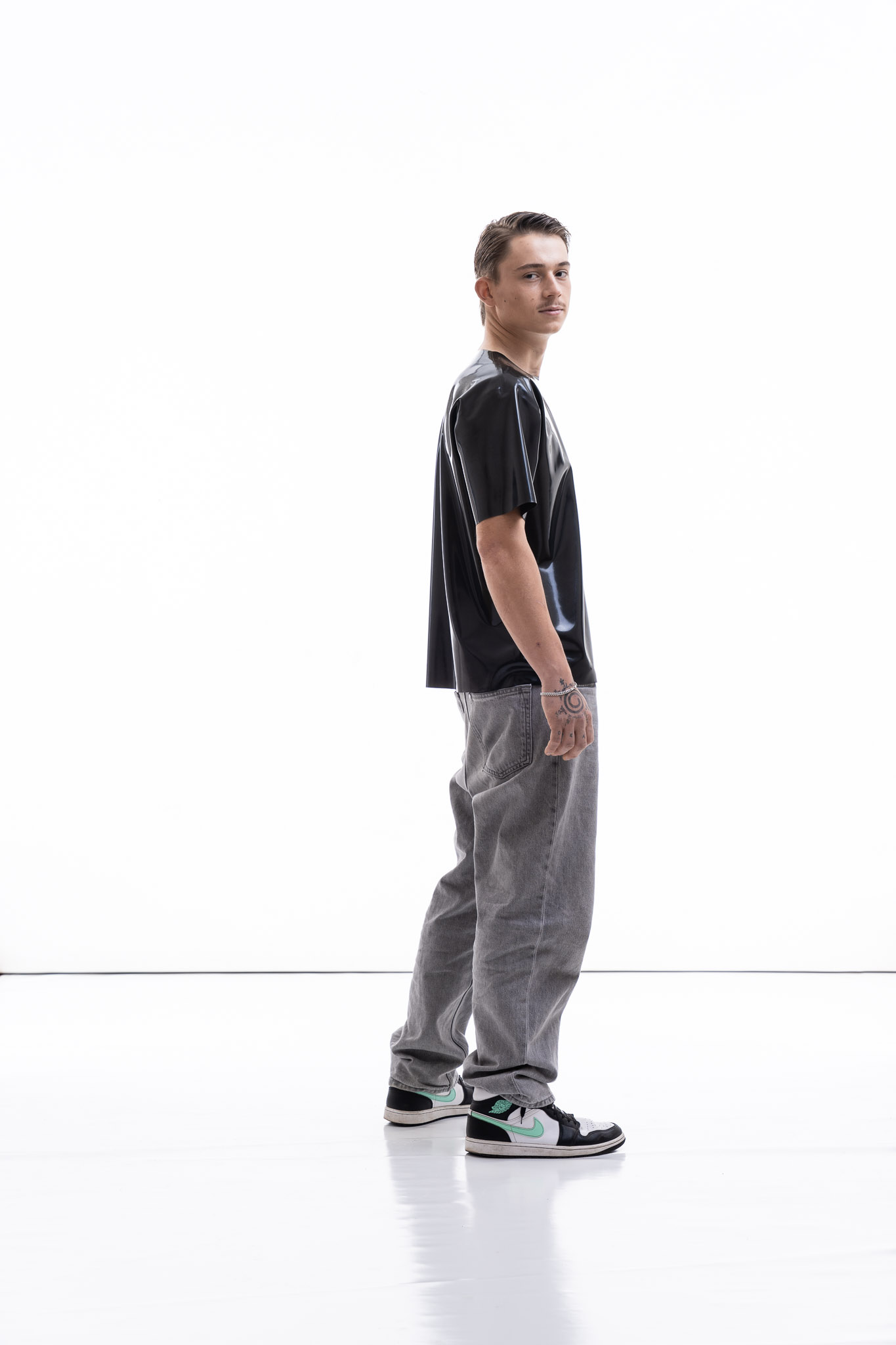 Metallic oversized latex shirt for men with relaxed fit, side view