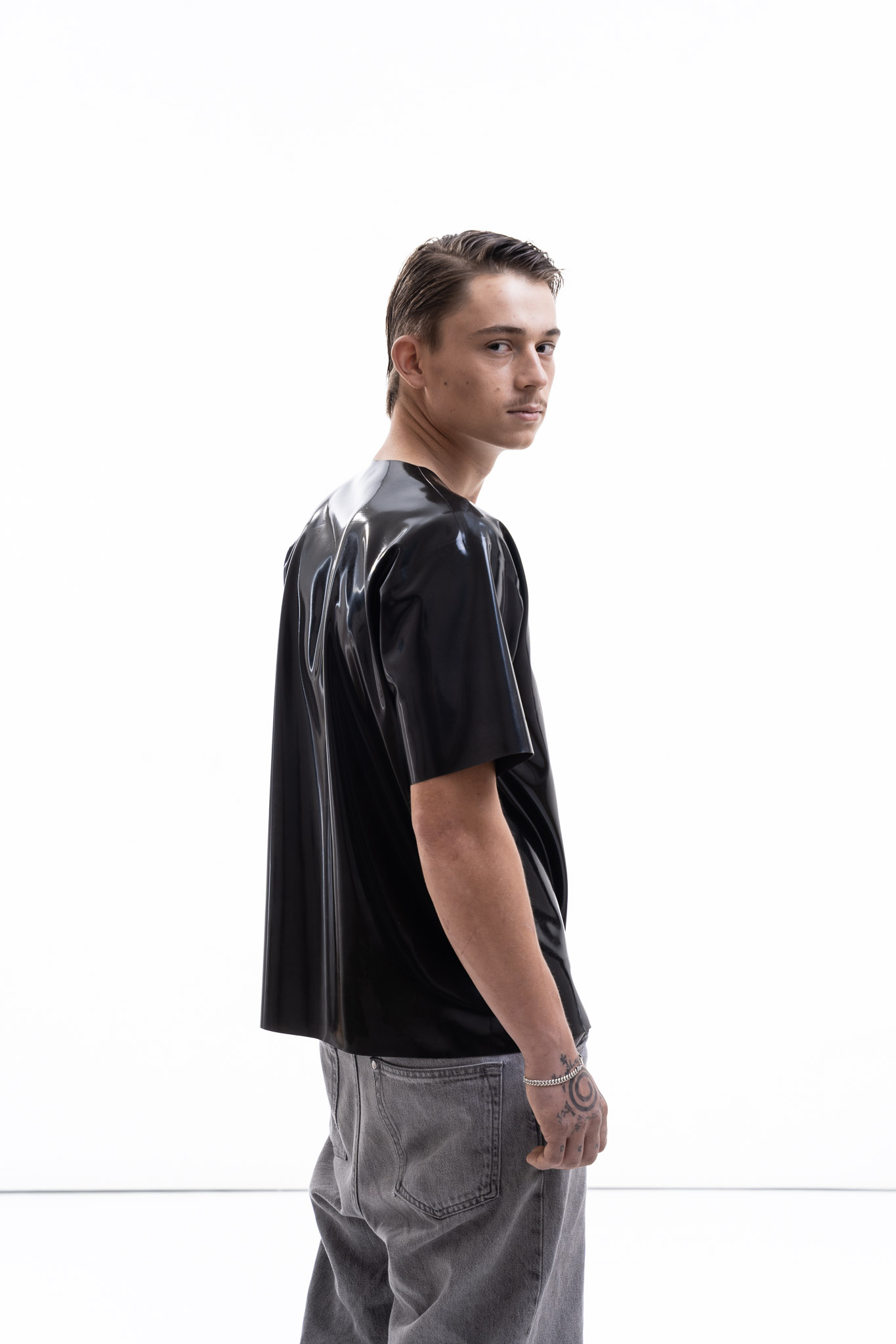 Metallic oversized latex shirt for men with relaxed fit, side detail view