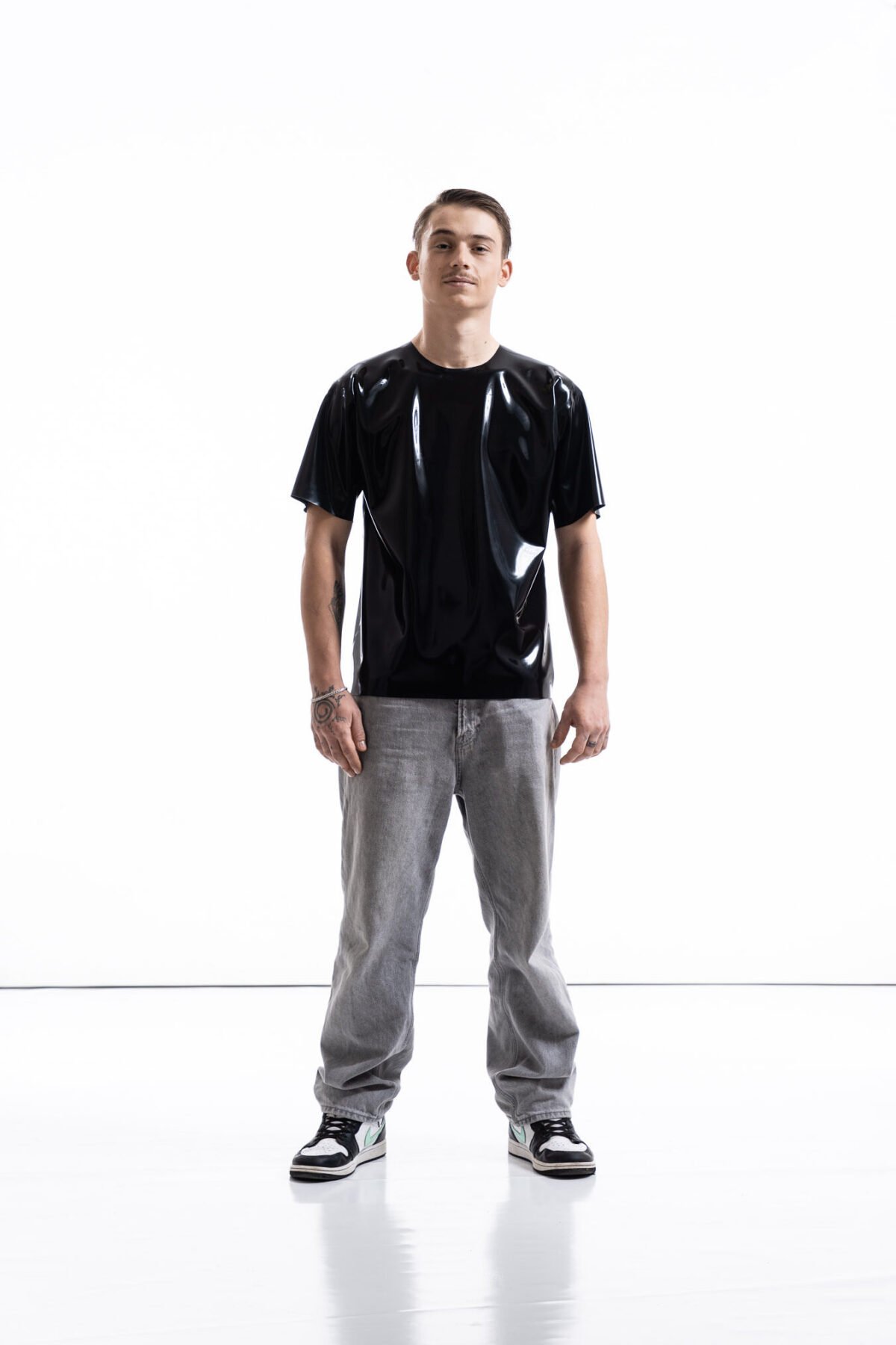 Black latex oversized shirt for men with relaxed silhouette, front view