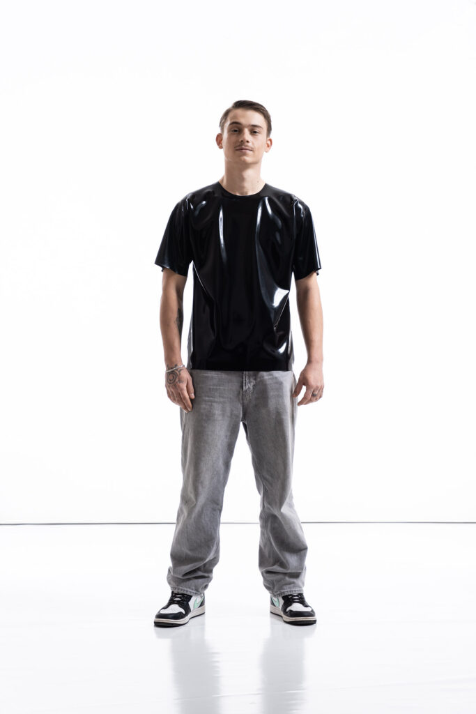 Black latex oversized shirt for men with relaxed silhouette, front view