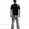 Black latex oversized shirt for men with relaxed silhouette, back view