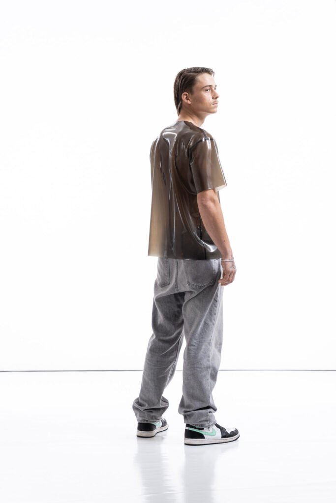 Smoky black latex oversized shirt for men with relaxed silhouette, side view