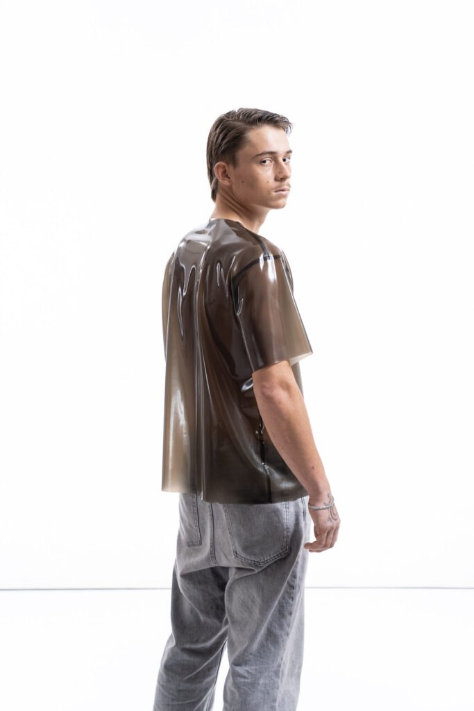 Smoky black latex oversized shirt for men with relaxed silhouette, side detail view