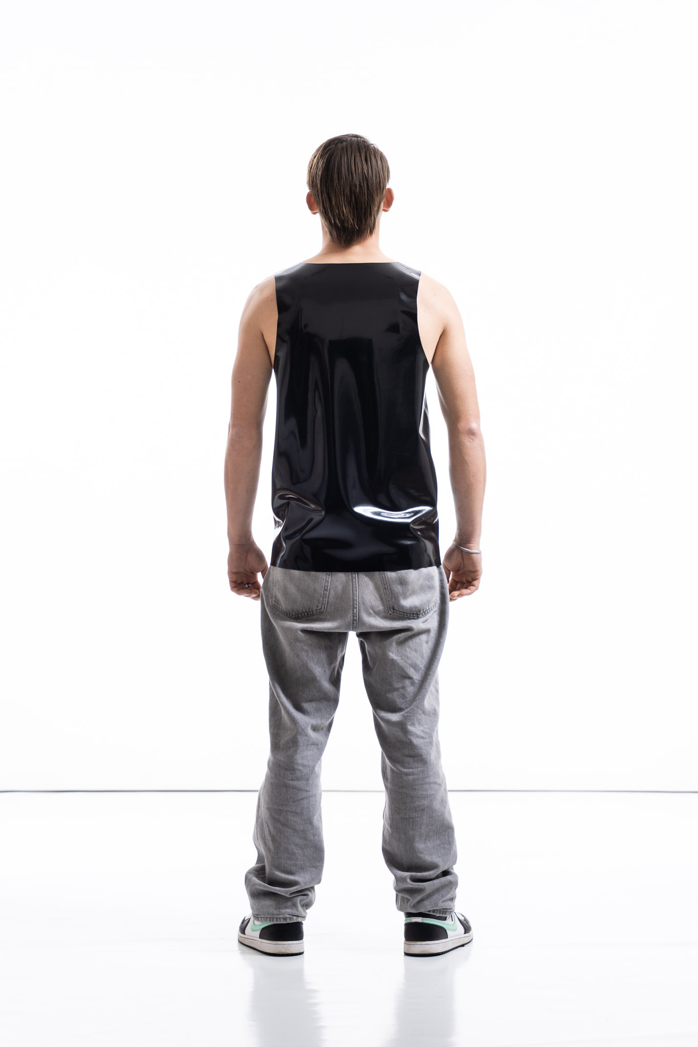 Black latex tank top for men with relaxed silhouette, back view