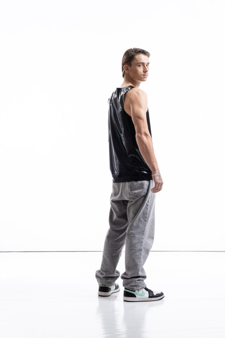 Black latex tank top for men with relaxed silhouette, side view